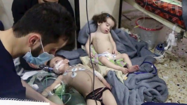 Medical workers treat toddlers following the gas attack in the opposition-held town of Douma in eastern Ghouta, near Damascus, on April 8 last year.