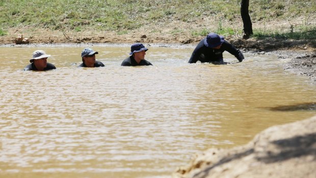 Divers search for Ms McBride's remains in a dam on in Muswellbrook in February, 2015.