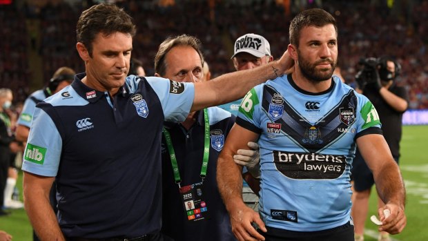 Brad Fittler consoles James Tedesco after a head knock forced him from the field in the Origin decider on Wednesday.