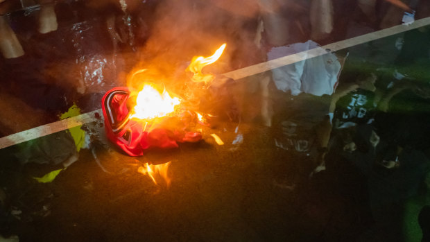 A LeBron James jersey burns during a rally in Hong Kong.