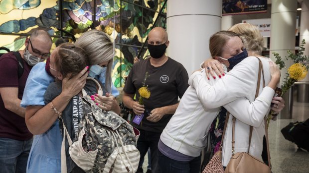 Families reunite at Sydney airport after the border reopened on November 1.