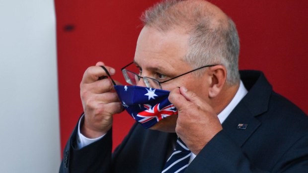 PM Scott Morrison dons an Australian flag mask.