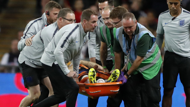 Concern: Luke Shaw was taken from the ground on a stretcher after a nasty collision.