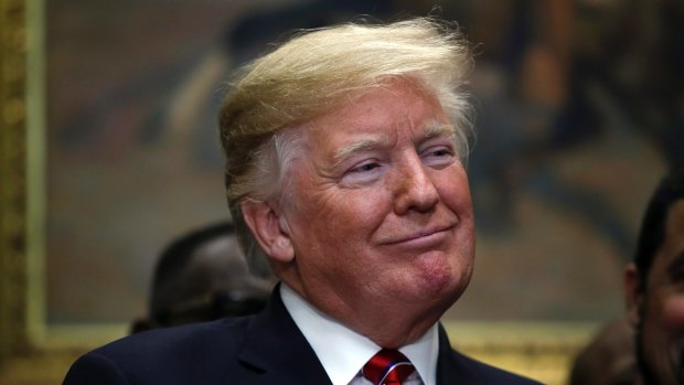 US President Donald Trump attends a ceremony where he signed an executive order establishing the White House Opportunity and Revitalization Council, in the Roosevelt Room of the White House.