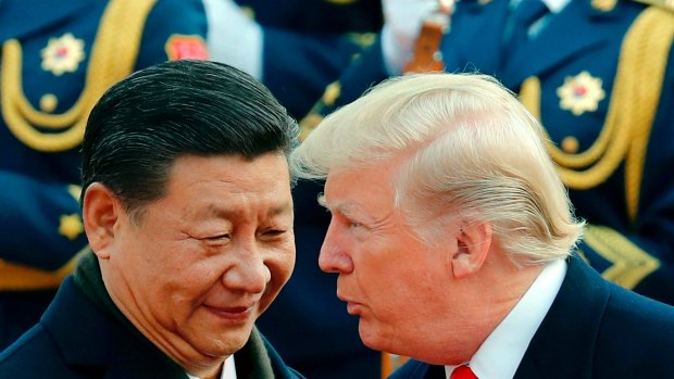 Chinese President Xi Jinping chats to Donald Trump during a welcome ceremony in Beijing in 2017.  