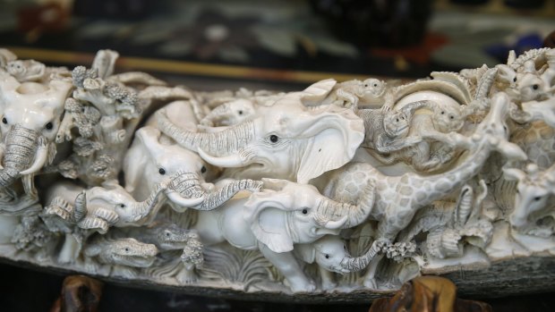 The business of elephants: Carvings of elephants made in an ivory tusk.