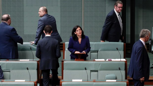 Julia Banks rises to speak to announce her decision to quit the Liberal party as Coalition MPs leave the chamber.