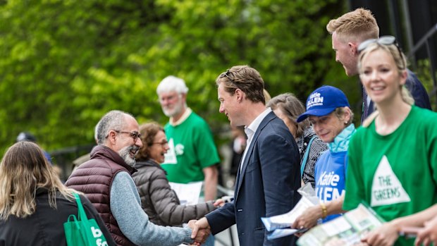 Greens candidate Sam Hibbins campaigning at South Yarra as Victoria voted in the state election. 