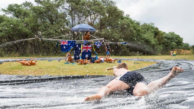 Hills Hoist Slide at Pine Island on Australia Day. Kaleb Dalla Costa tries to hold on as he spins around the slide. 