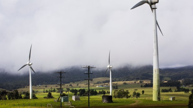 New wind turbines, similar to these in the Atherton Tablelands, are being built on sheep grazing land at Warwick as Queensland shifts towards providing 33 per cent of energy from renewables by 2030.
