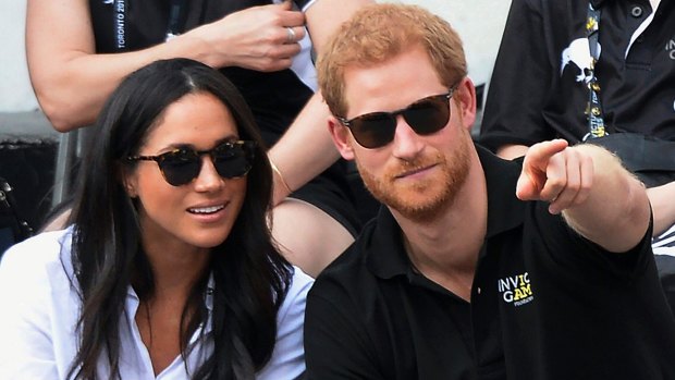 Prince Harry and his then girlfriend Meghan Markle attend the wheelchair tennis competition during the Invictus Games in Toronto last year.