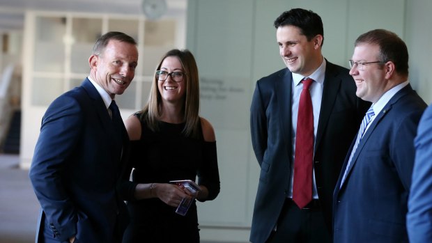 Liberal Party federal director Andrew Hirst (centre), with former prime minister Tony Abbott, is being credited with the Coalition's election win.