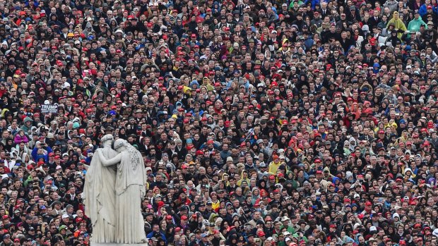 People listen during the inaugural address by President Donald on January 20, 2017.
