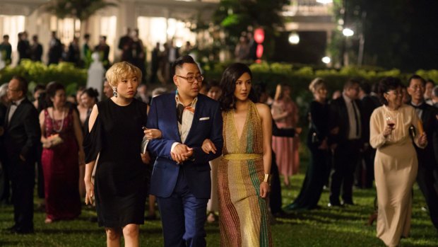 Awkwafina, Nico Santos and Constance Wu in a scene from the film "Crazy Rich Asians."