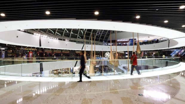 Shoppers at the Tongzhou Wanda Plaza shopping centre, operated by Dalian Wanda Group, in Beijing.