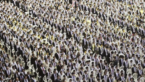 Couples from around the world participate in a mass wedding ceremony at the Cheong Shim Peace World Centre in Gapyeong, South Korea, in 2015. 