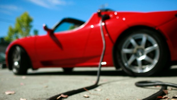 A Tesla Roadster being charged.