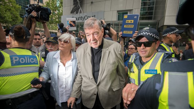 George Pell leaves the County Court where was found guilty of sexual offences.