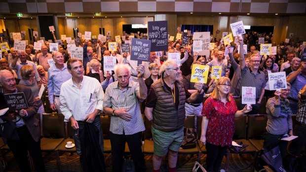 Investors at the Wilson Asset Management event protesting against Labor's policy.