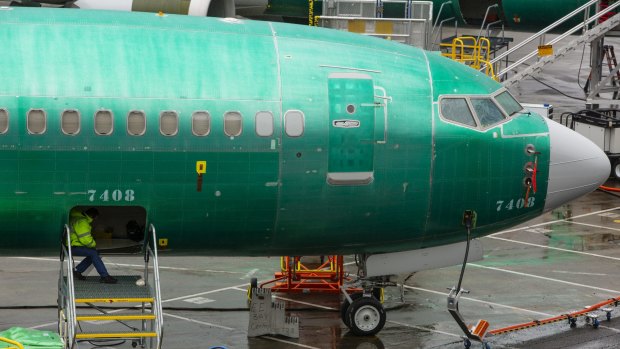 An employee works on a 737 Max 8 plane destined for China Southern Airlines at the Boeing Co. manufacturing facility in Renton, Washington, US. 