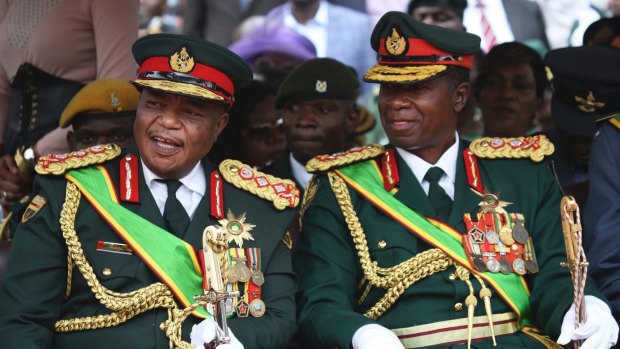 Army General Constantino Chiwenga, left, chats with General Valerio Sibanda during the presidential inauguration ceremony last year.