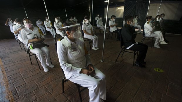 Mexican army health workers wait to be vaccinated against COVID-19 at the Central Military Hospital in Mexico City.