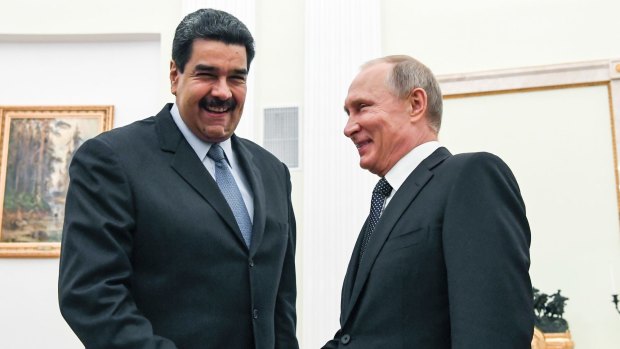 Russian President Vladimir Putin, right, shakes hands with Venezuela's President Nicolas Maduro in Moscow in October 2017.