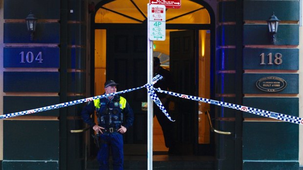 Police outside the Clarence Street apartment where the woman was found dead.