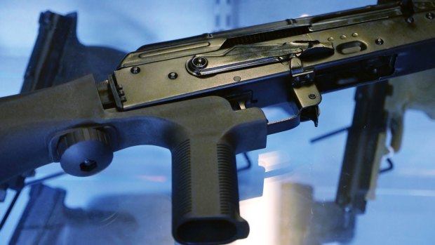 A device called a bump stock is attached to a semi-automatic rifle at the Gun Vault store and shooting range in South Jordan, Utah. The controversial device was used in the Las Vegas shooting, allowing a semi-automatic rifle to mimic a fully automatic firearm. 