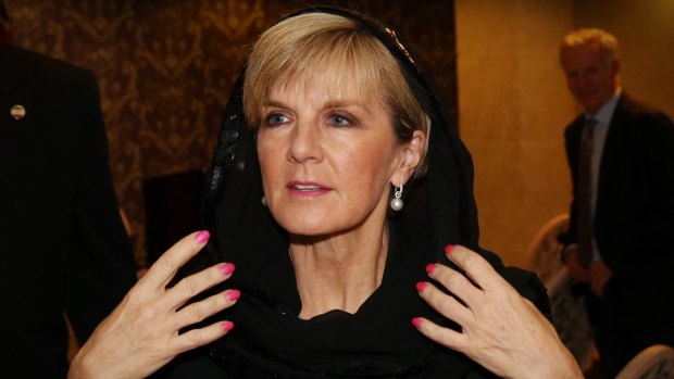 Julie Bishop replaces her head scarf after a press conference with the Australian media in Tehran in 2015.