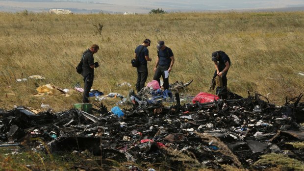Australian Federal Police officers and their Dutch counterparts as they searched for human remains and personal belongings from the MH17 crash site.