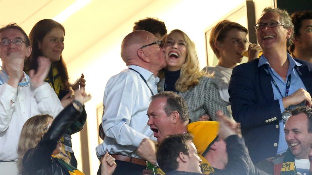 Rupert Murdoch and fourth wife Jerry Hall celebrate with a kiss in the stands during the Rugby World Cup in 2015.