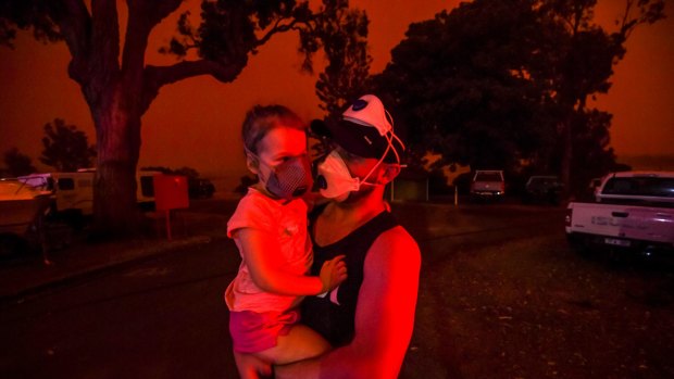The sky in Mallacoota turned blood red on January 4, when a south-westerly wind change fanned flames. Mike and his daughter Elsie were still trapped in the tiny coastal town five days after the first fire ripped through. 
