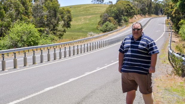 Peter Tzamouranis's life was saved, along with the lives of two people travelling in oncoming direction, when he crashed his car into a wire rope barrier on Melba Highway after he fell asleep at the wheel..