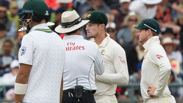 Dark day: Australia's Cameron Bancroft speaks with the umpire at Newlands in March.