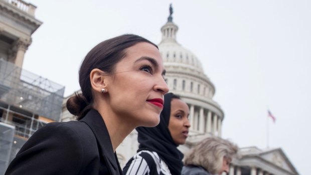 Rep. Alexandria Ocasio-Cortez wearing her signature red lipstick. 