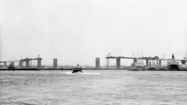 A photograph taken from the water shows the area missing from the bridge after the collapse.