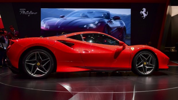 Authorities allege the man bought a Ferrari among other luxury cars with funds aimed at helping small businesses survive the COVID pandemic.