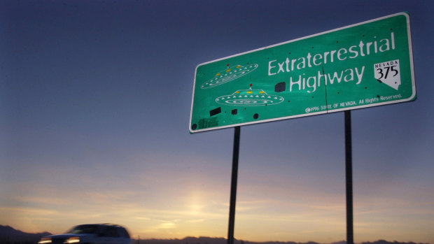A vehicle moves along the Extraterrestrial Highway near Rachel, Nevada.