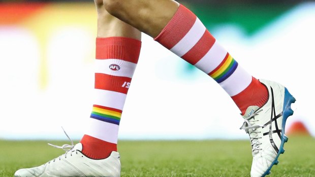 Lance Franklin of the Swans wears rainbow-coloured socks during the round 21 AFL match between the St Kilda Saints and the Sydney Swans.
