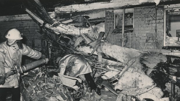 The plane wreckage wedged against the home of Giuseppe and Angela Corrso in Elstone Avenue. 