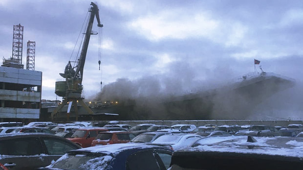 In this handout photo provided by an  anonymous source, smoke billows from the Admiral Kuznetsov carrier during a fire in Murmansk, Russia.