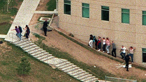 Police officers outside Columbine High School during the shooting rampage in 1999 in which 12 students and a teacher were killed.