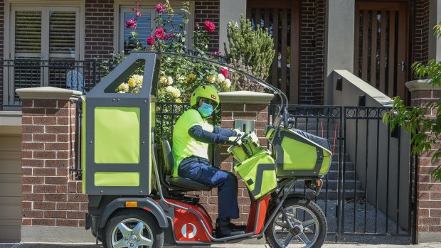 Postman Mohammed Tehseen on his route delivering parcels early in the pandemic. 