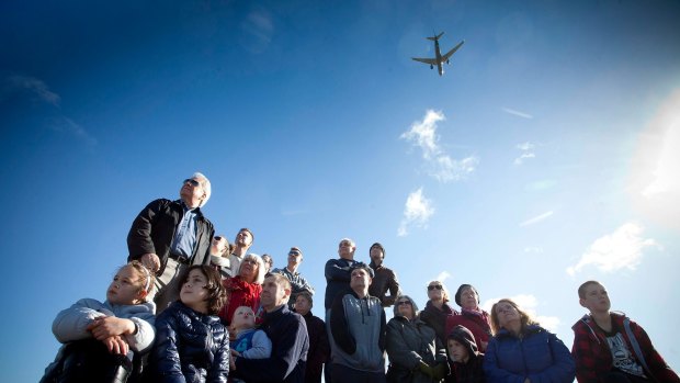 Residents who live near Melbourne Airport protest against plans for a third runway near their homes. 