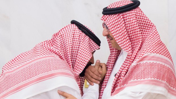 A newly appointed Mohammed bin Salman, left, kisses the hand of Prince Mohammed bin Nayef at the royal palace in Mecca, Saudi Arabi in 2017.