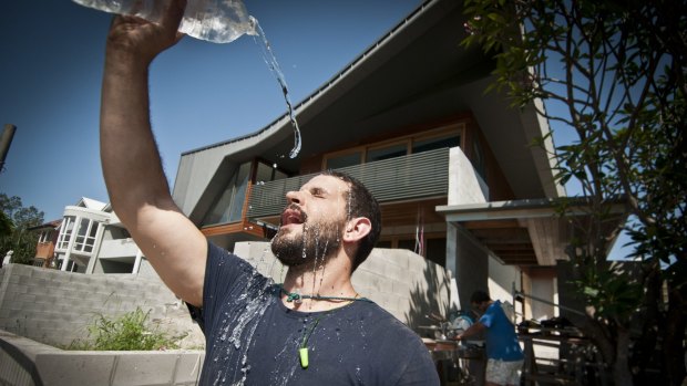 Carpenter Buddy Kirner tries to keep cool in the Brisbane heat.