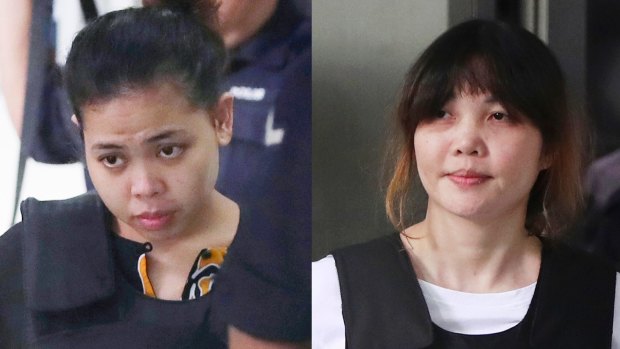 Indonesian Siti Aisyah, left, and Vietnamese Doan Thi Huong, right, escorted by police as they leave a court hearing in Shah Alam, Malaysia last year.