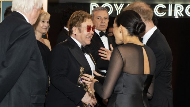 The Duke and Duchess of Sussex with Elton John at the European Premiere of Disney's The Lion King.