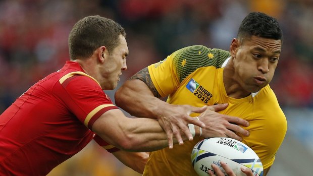 Israel Folau is tackled by George North during Australia's win over Wales at the 2015 Rugby World Cup. 
